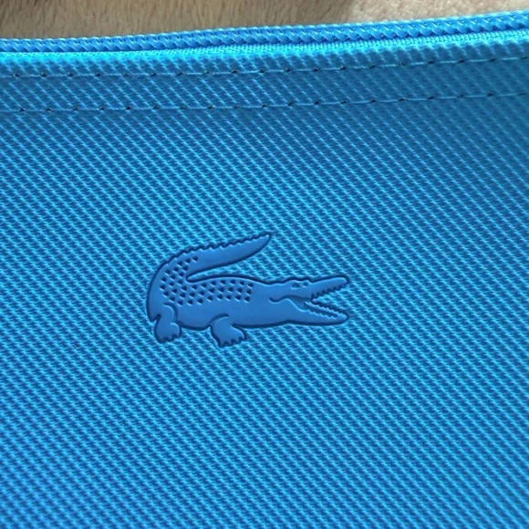 Lacoste Blue Pouch with About Face and NYX makeup products - Picture 2 of 6